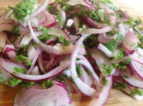 Meanwhile, thinly slice red onion, jalapeno, cilantro. Add a good amount of lime juice to the vegetables and a little olive oil.